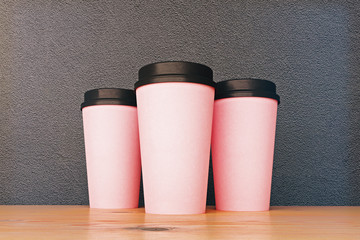 Empty pink take out coffee cups