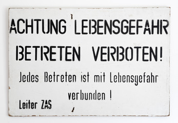 East - West German border warning sign. Found during the reunification of Germany at the end of the Cold War. Translation: Warning danger to life. Entry prohibited. Every ingress is life threatening.