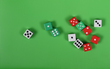 Gambling dice on green background and texture