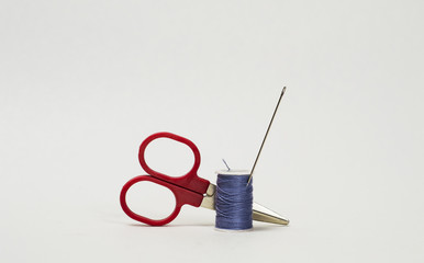Scissor and blue thread