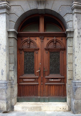 Fototapeta na wymiar antique door with beautiful wrought iron floral pattern