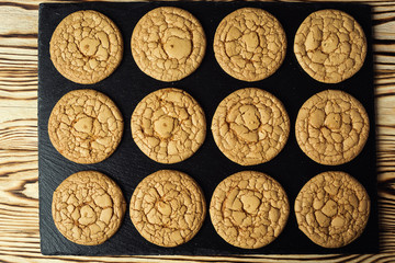 Biscuit sweet cookie background. Domestic stacked butter biscuit pattern concept,close up macro.Homemade cookies on wooden table.Cereal biscuits with the sesame,peanuts,sunflower and amaranth.