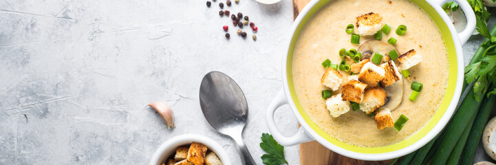 Creamy Mushroom Soup with croutons. Long banner format.