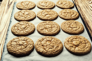 Biscuit sweet cookie background. Domestic stacked butter biscuit pattern concept,close up macro.Homemade cookies on wooden table.Cereal biscuits with the sesame,peanuts,sunflower and amaranth.