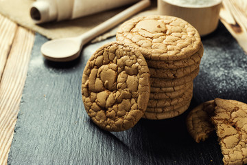 Biscuit sweet cookie background. Domestic stacked butter biscuit pattern concept,close up macro.Homemade cookies on wooden table.Cereal biscuits with the sesame,peanuts,sunflower and amaranth.
