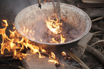 big flames of fire - traditional cashew roasting