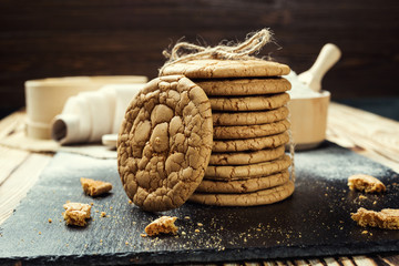 Biscuit sweet cookie background. Domestic stacked butter biscuit pattern concept,close up macro.Homemade cookies on wooden table.Cereal biscuits with the sesame,peanuts,sunflower and amaranth.