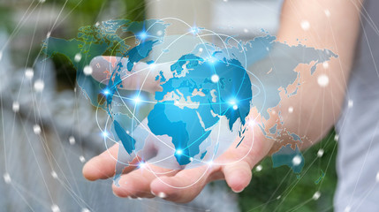 Businessman holding global network on planet earth 3D rendering