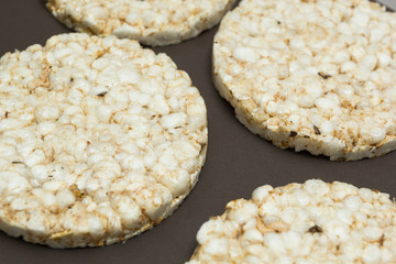 Rice bread on a brown background.