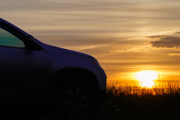 Fototapeta na wymiar the silhouette of the car at sunset