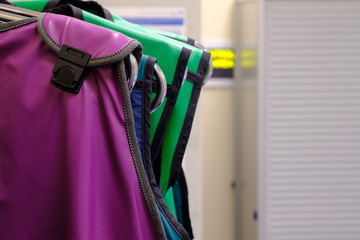 Radiation protection lead gowns hanging in a control area in radiology department