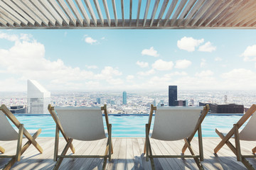 Fototapeta premium Row of white chairs near a pool in a city