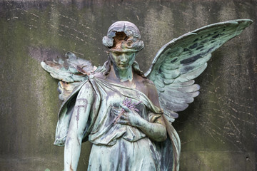 damaged sculpture of a female angel statue