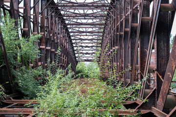 abandoned steel bridge - rusted steel beam construction