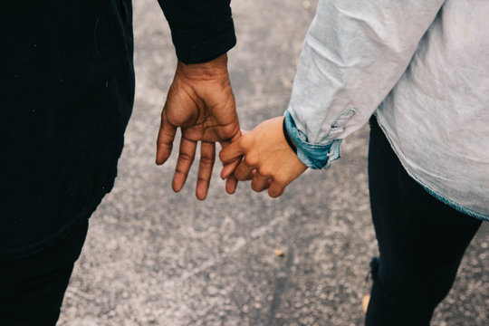 Heterosexual african american romantic Couple holding hands