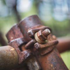 rusty screw and nut on scaffolding closeup