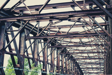 Fototapeta premium old rusty steel bridge construction - rusted steel beams