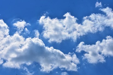 Bright White Clouds In The Blue Sky 