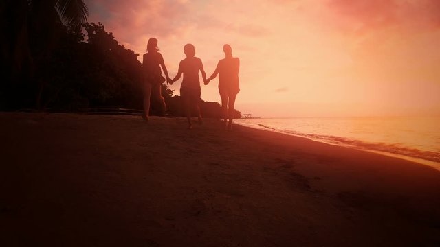 Group of friends celebrating on the beach.