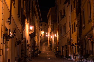 Night view of a street in the historic center of Massa Marittima in the province of Grosseto in Tuscany