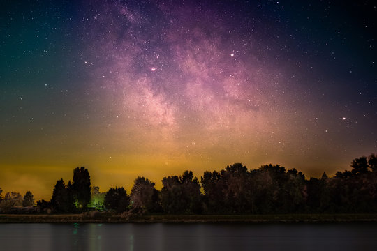 The Galactic Center as seen from the shore of the river Rhine at Mannheim in Germany.
