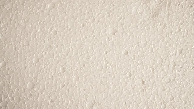 White polystyrene foam surface background texture. Dolly sliding shot 4K ProRes HQ codec
