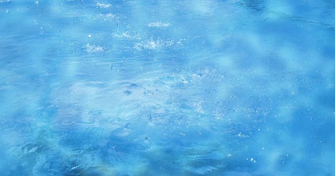 blue sea ocean waves water calm movement background in sunny day with sun light on surface with water drops, nature and peace concept