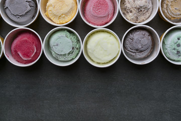 Top view Ice cream flavors in cup on blackground