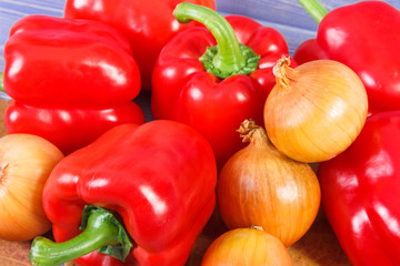 Onions and peppers with autumnal leaves, healthy diet, nutrition and seasonal concept