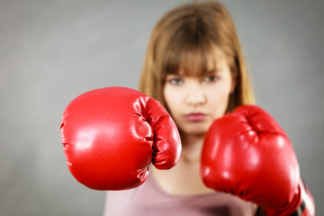 Woman wearing boxing gloves