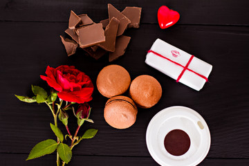 Classic French macaroons on a black background