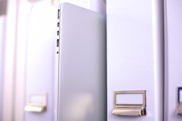 folders with documentation with binders in background