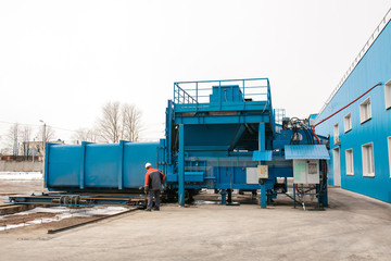 Preparation of a container with waste for subsequent transportation to a waste disposal plant. Waste processing plant. Business for waste sorting and processing.