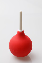 Red enema on a white background