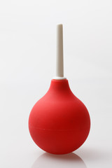 Red enema on a white background