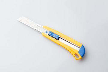 Photo of clerical knife close-up on white empty background