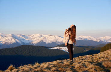 Rearview shot of a woman hiking in the mountains looking in the sky copyspace nature beautiful landscape hiker sportive human lifestyle active concept