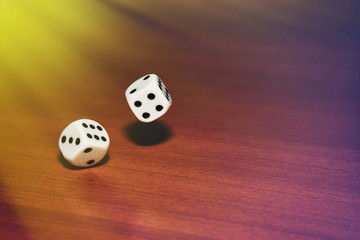 Dice thrown on the table. Sunrise. Toned.