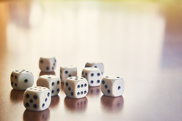 Dices on the table. Sunrise. Toned.