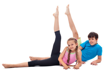 Fototapeta na wymiar Kids doing gymnastic exercise - isolated