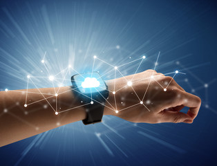 Female hand with smartwatch and cloudy icons