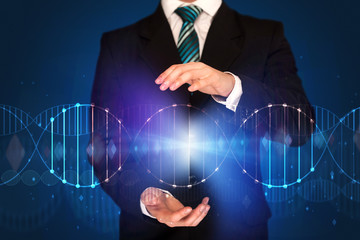 Businessman holding DNA