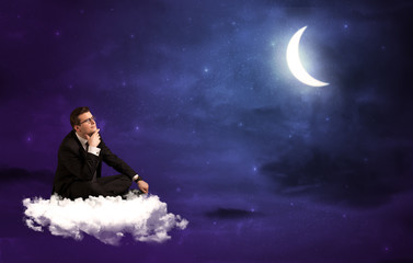 Fototapeta na wymiar Man sitting on cloud