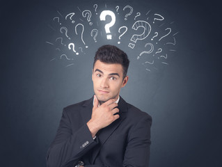 Businessman with question marks