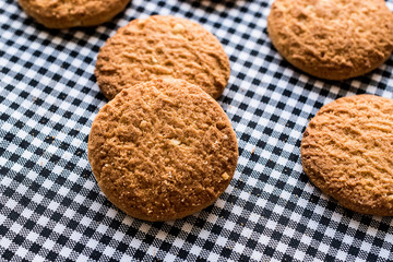 Anzac Biscuits on tablecloth.