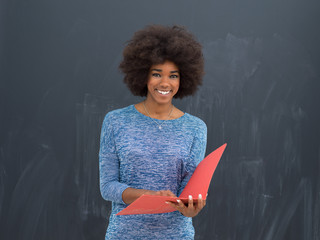 African American woman with red folder