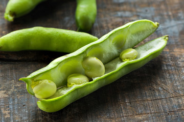 Fresh broad bean pods - closeup with selective focus