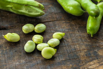 Fresh broad bean pods - closeup with selective focus