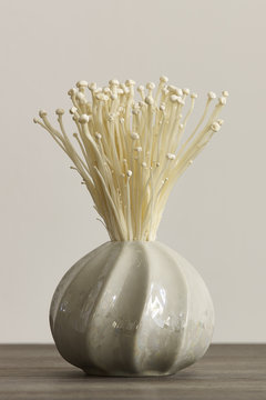 Enoki mushrooms in a vase