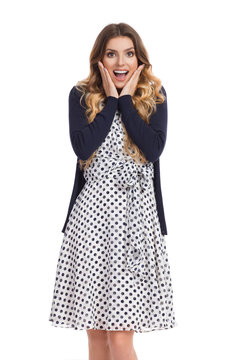 Excited Young Woman In White Dotted Dress And Cardigan